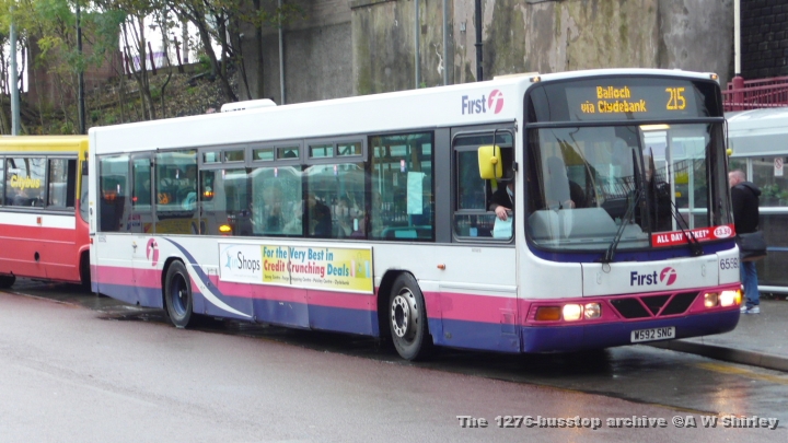 fig6559201301009.JPG - First Glasgow 65592, Another Low Floor Import At Dumbarton, Heading For Balloch On The 215